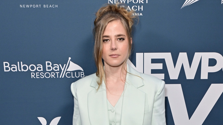 Closeup of Taylor Dearden posing on step-and-repeat