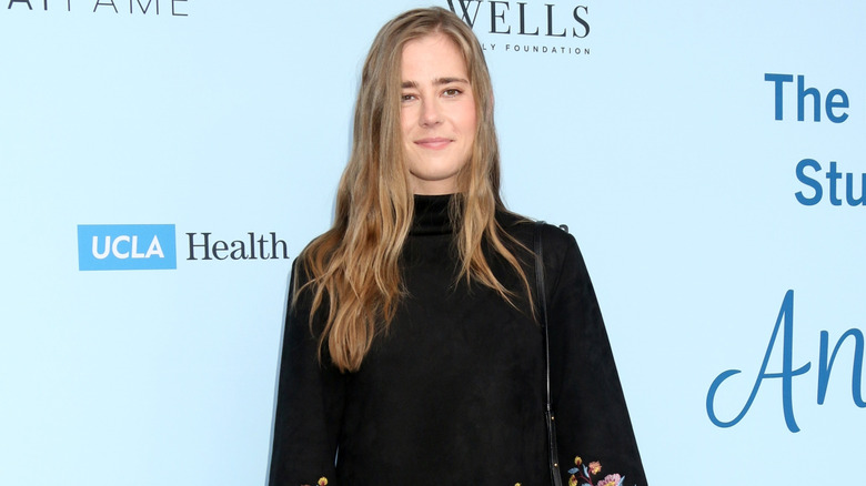 Taylor Dearden posing on step-and-repeat