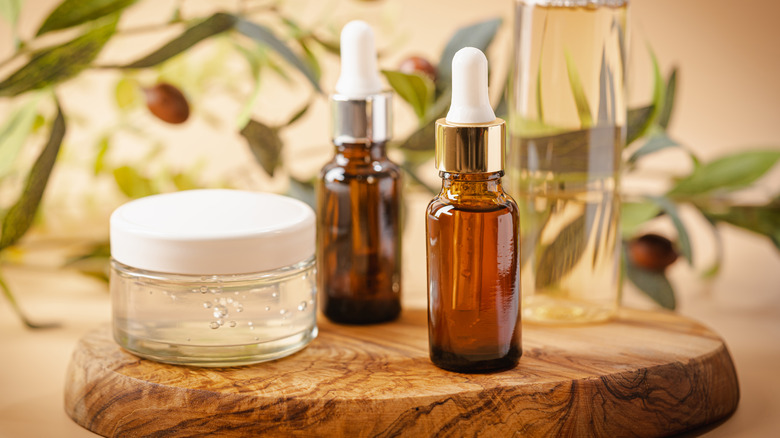 Serum and containers on wooden stand