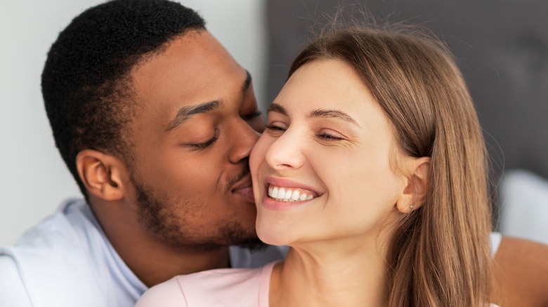 Couple kissing and smiling