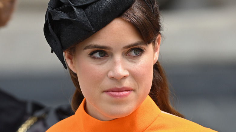 Princess Eugenie at a National Day of Thanksgiving in a vivid orange dress 