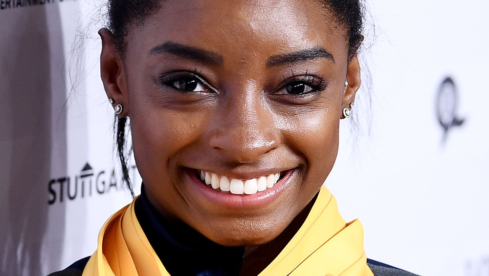 Gold medalist Simone Biles smiling