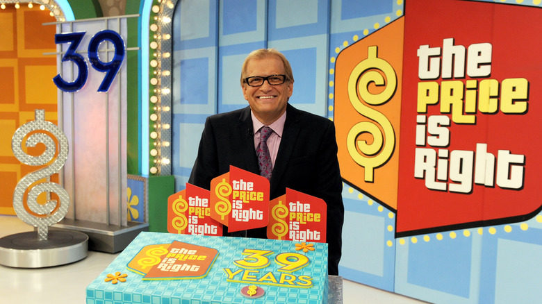 Drew Carey posing on the set of "The Price Is Right"