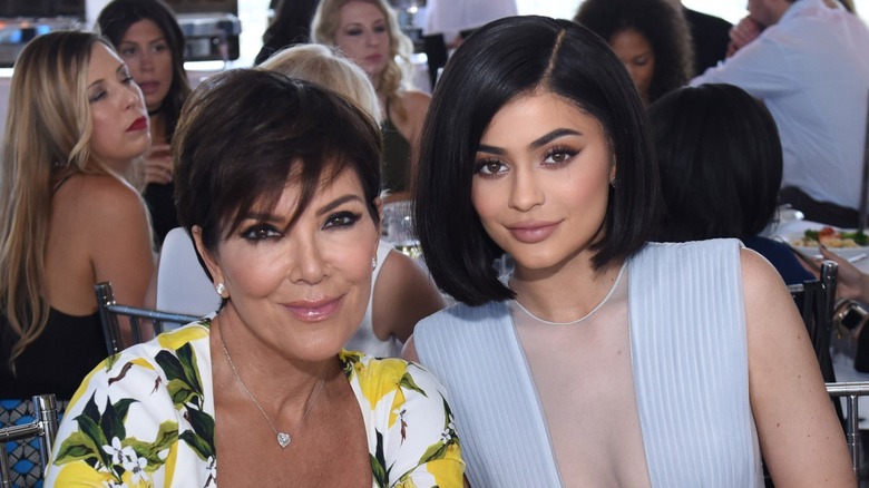 Kris Jenner and her daughter Kylie Jenner seated together in 2016.