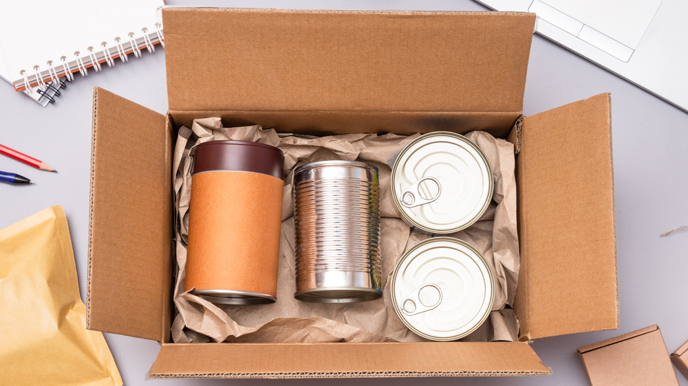 Cardboard box with cans.