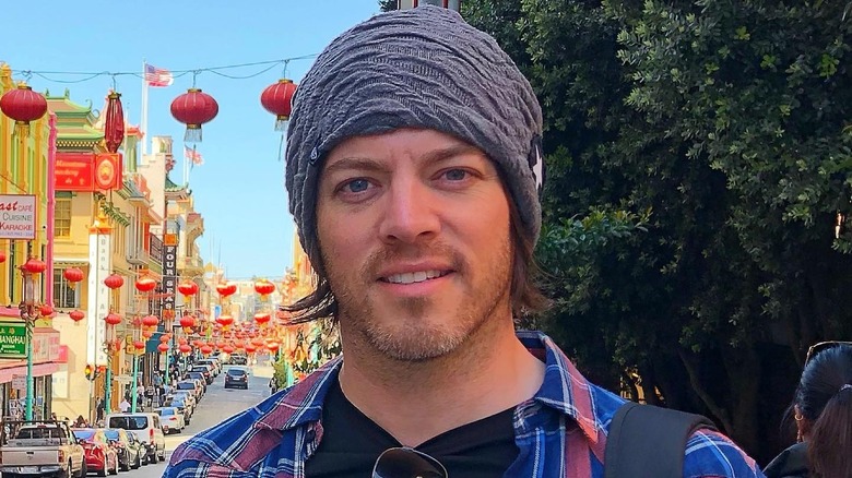 J.D. Scott smiles in a beanie in Chinatown