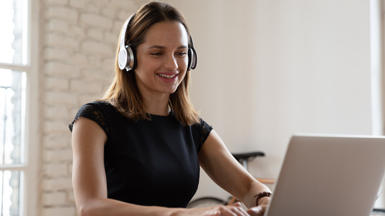 Woman listening to music at work