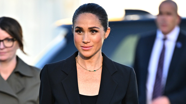 Meghan Markle wearing a black suit