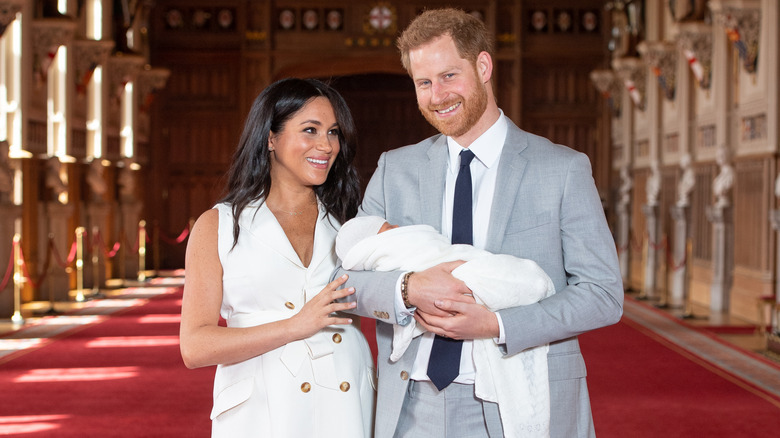 Meghan Markle and Prince Harry showing off baby Prince Archie during a photo call