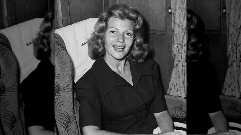 Rita Hayworth sitting