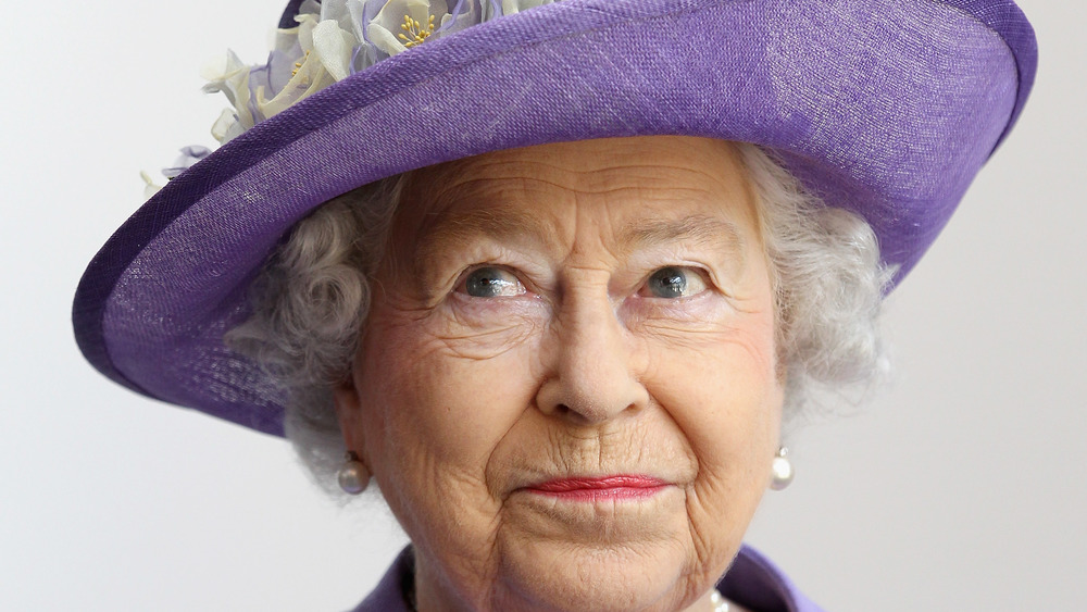 Queen Elizabeth II in purple hat