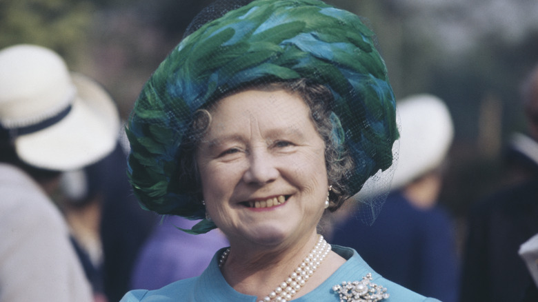 The Queen Mother in a feather hat