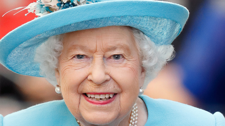 Queen Elizabeth in blue hat