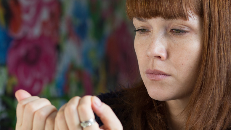 woman staring at nails