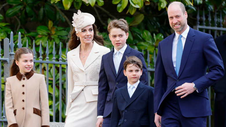 Prince William and Kate Middleton walking with their three children