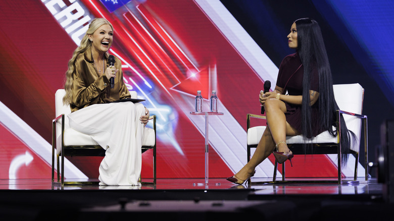 Erika Kirk speaking with Nicki Minaj at a Turning Point event