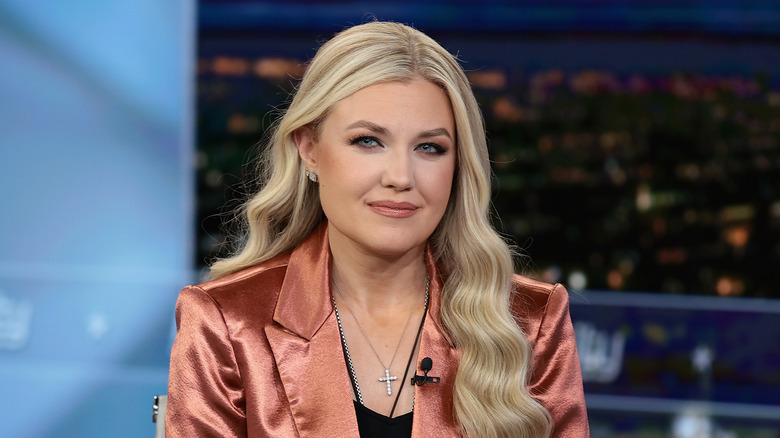 Erika Kirk smiling for the cameras on a TV interview