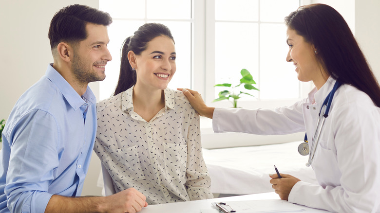 Couple discussing with doctor