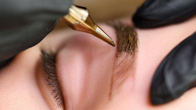 A woman getting microblading