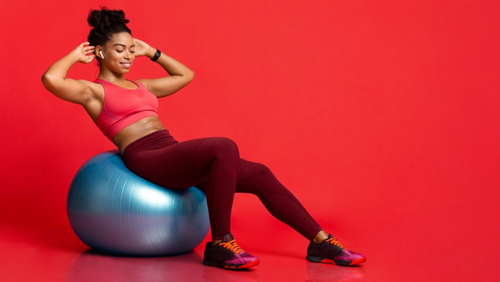 Woman exercising with an exercise ball