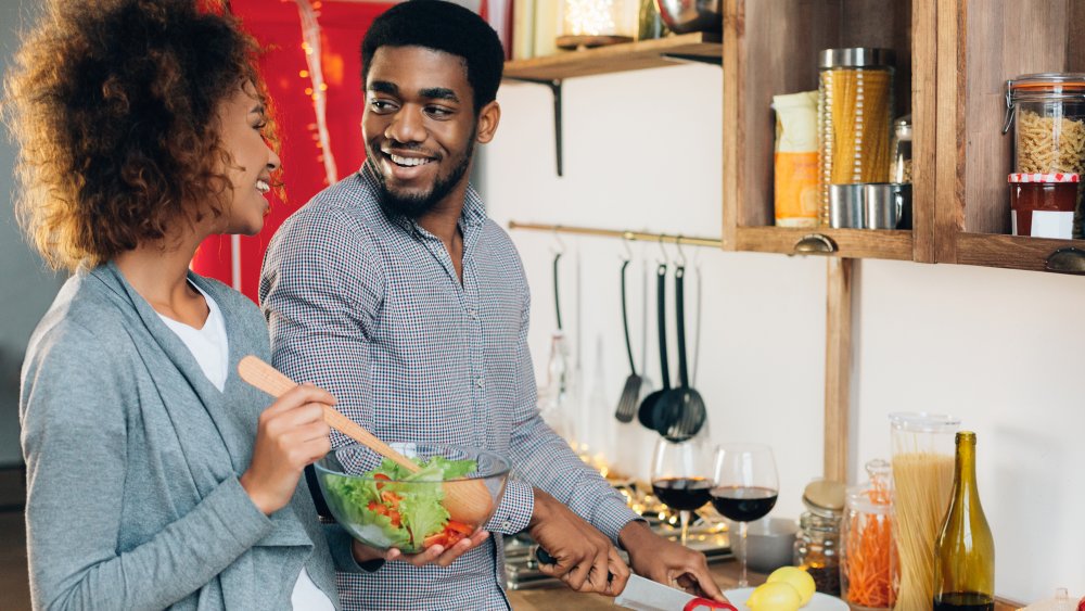 couple making dinner together