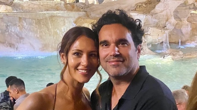 Actor Nicole Major smiles next to her husband Mike in front of the Trevi fountain in Rome