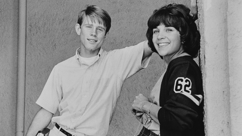 Cindy Williams (right) and Ron Howard as Laurie and Steve on the set of the Lucasfilm production 'American Graffiti', distributed by Universal Pictures, 1973.