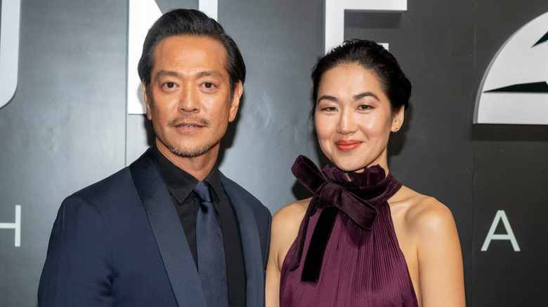 Jackie Chung and her husband Louis Ozawa posing at an event