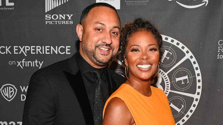 Michael Sterling and Eva Marcille smiling