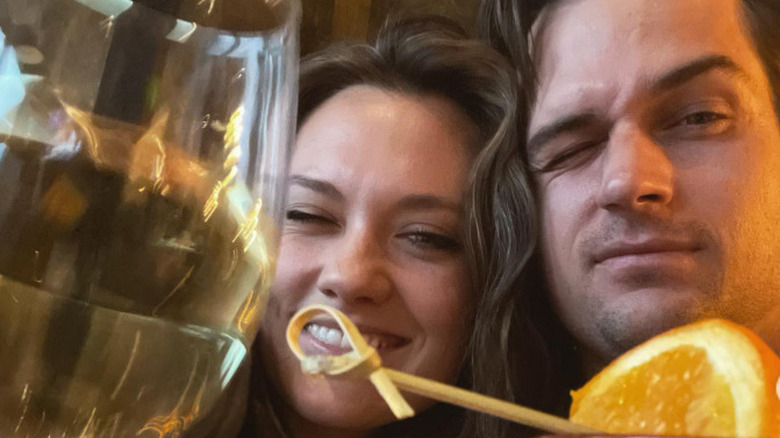 Laura James and Jon-Michael Ecker with a glass of alcohol