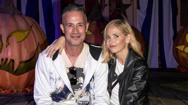 Freddie Prinze Jr. and Sarah Michelle Gellar posing in front of pumpkins in 2023