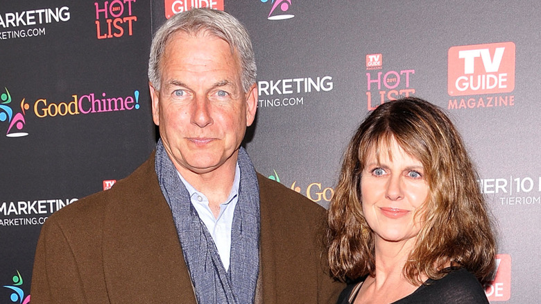 Mark Harmon in a coat beside wife, Pam Dawber