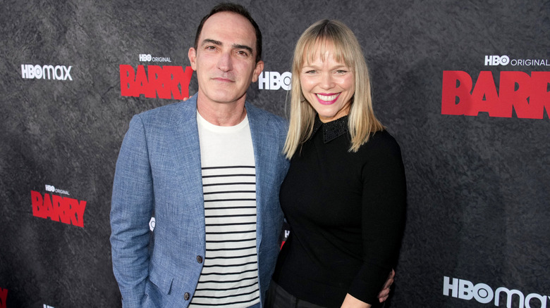 Patrick Fischler and Lauren Bowles with their arms around each other.