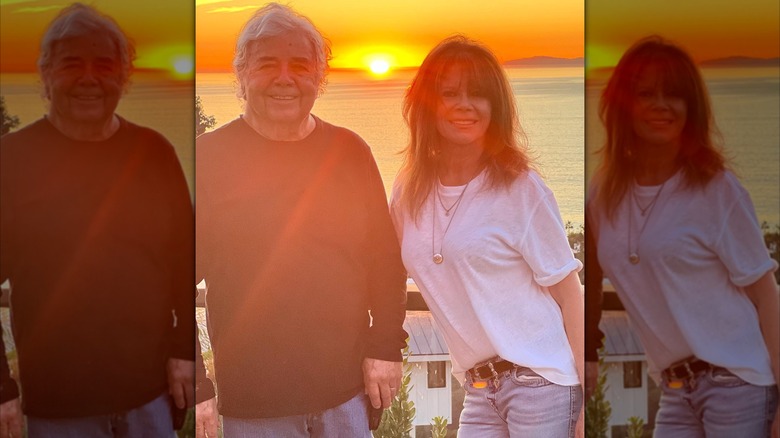 Mary Margaret Humes with her husband, Raul A. Bruce, in front of a sunset