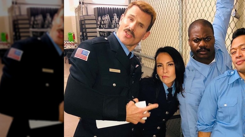 Gabriel Hogan pointing at Inga Cadranel alongside co-stars