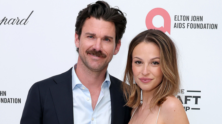 Kevin McGarry and Kayla Wallace posing at a watch party in West Hollywood