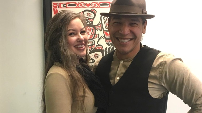 Nathaniel Arcand posing with his wife
