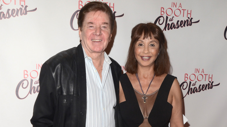 Bobby and Brigitte Sherman posing and smiling at an event in 2018