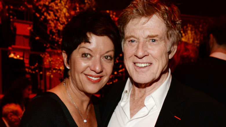 Sibylle Szaggars and Robert Redford smiling and posing at an event in 2015