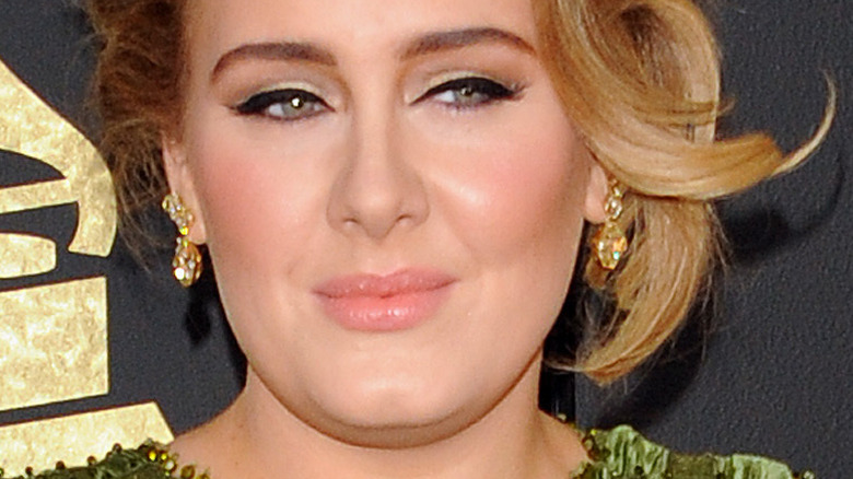 Adele on the Grammys red carpet with updo and cat eye