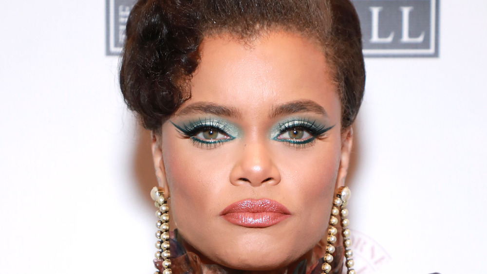 Andra Day looking serious in dramatic makeup