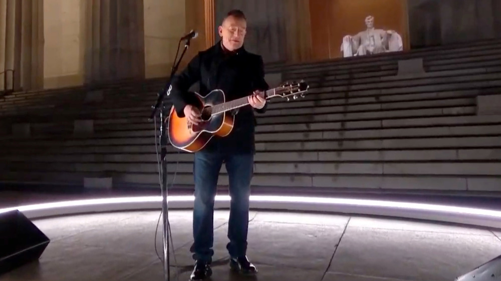 Bruce Springsteen at inauguration concert holding guitar