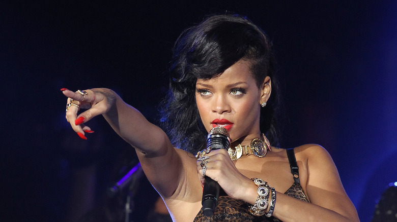rihanna performs pointing at crowd