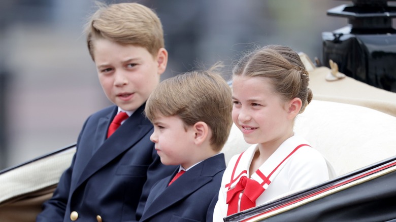 Prince George, Princess Charlotte and Prince Louis, wearing coordinated outfits