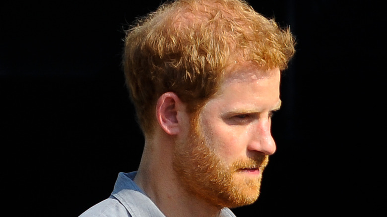 Prince Harry wearing a light shirt 