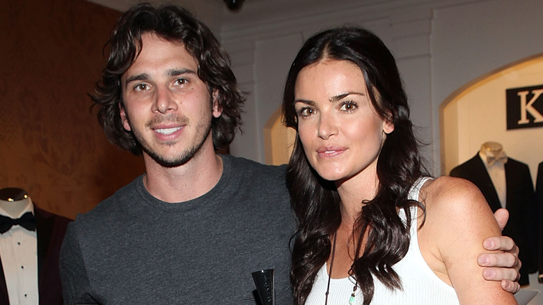 Ben Flajnik and Courtney Robertson pose together at an event