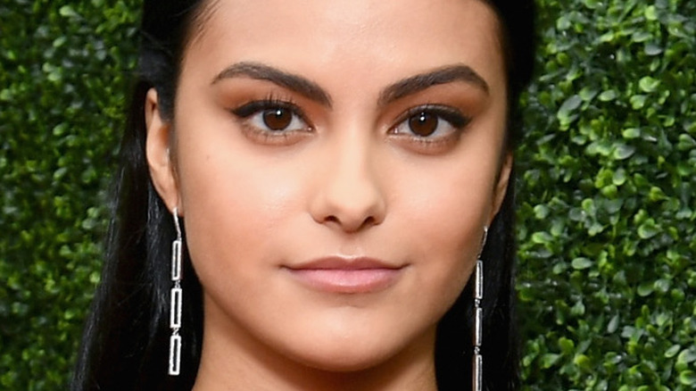 Camila Mendes poses on the red carpet