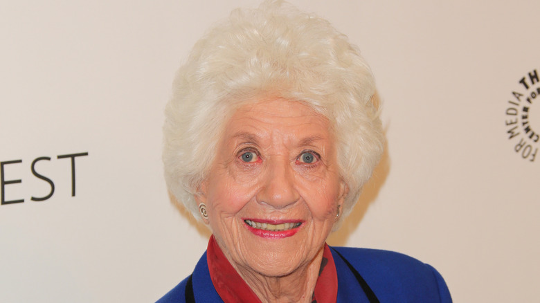 Charlotte Rae smiling while posing at an event