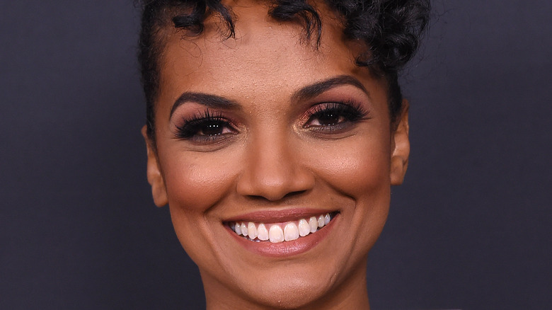 Mekia Cox smiling on the red carpet