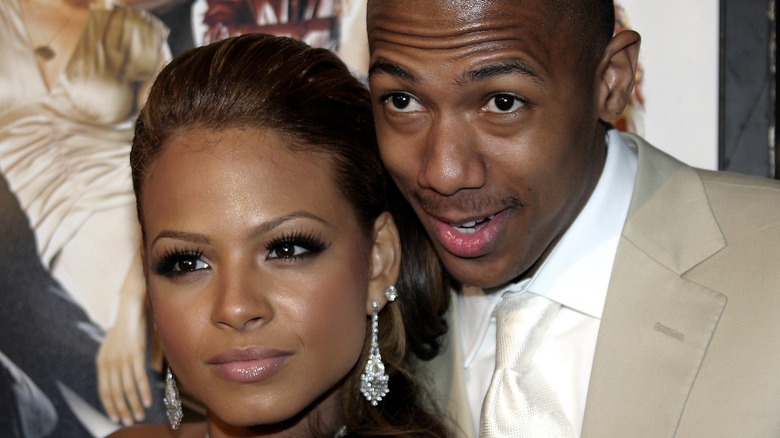 Nick Cannon and Christina Milian posing together